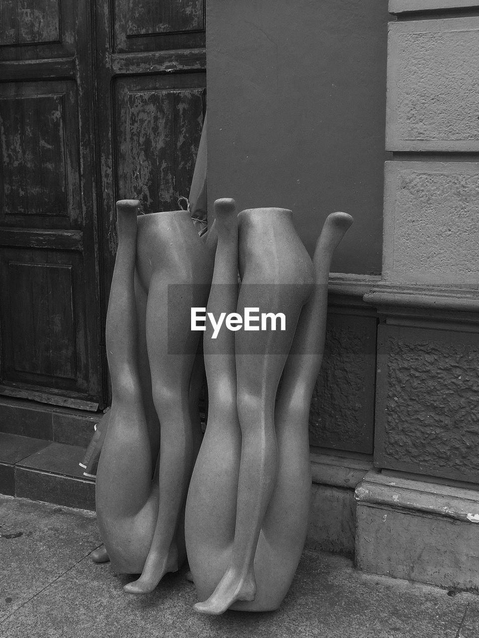 Mannequin legs outdoors in black and white