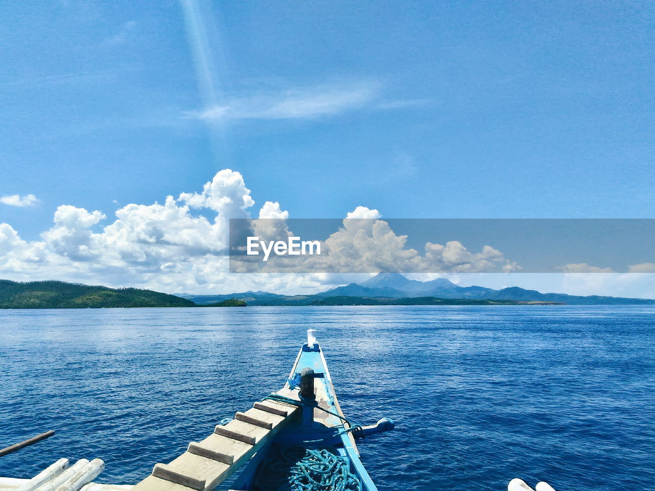 Scenic view of calm sea against blue sky