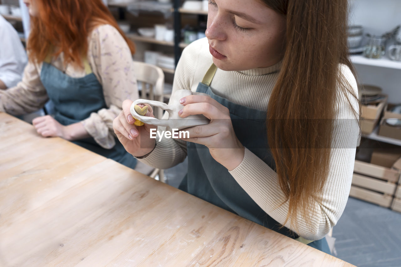 Pottery workshop class. a popular hobby is making ceramic dishes from a raw clay