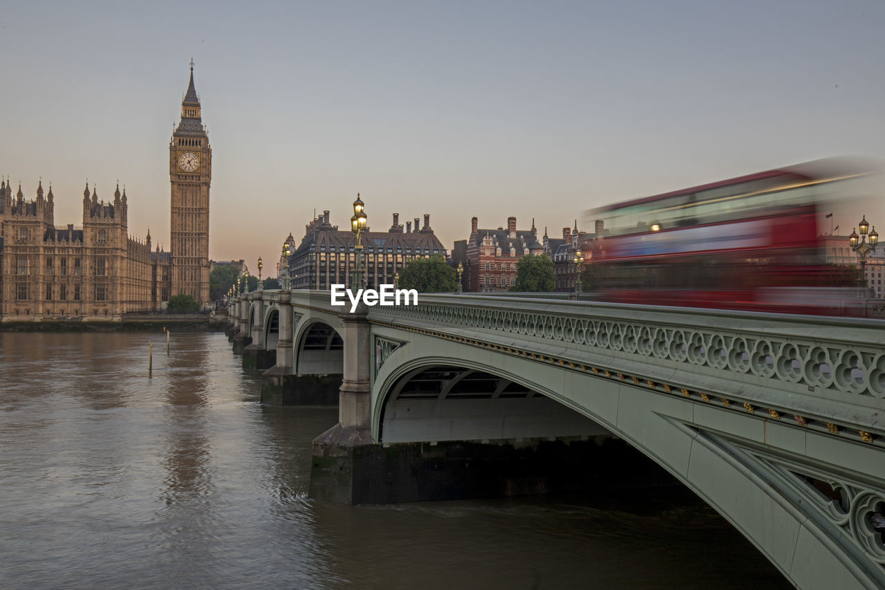 Tower bridge over thames river against clear sky during sunset