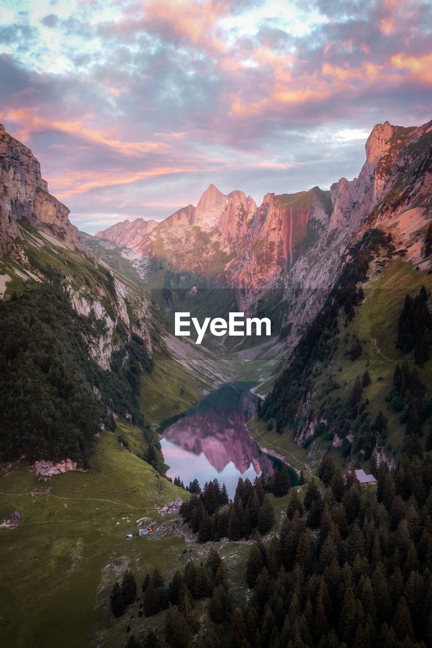 scenics - nature, mountain, environment, landscape, beauty in nature, sky, nature, land, sunset, wilderness, cloud, mountain range, travel destinations, travel, plant, rock, valley, water, no people, tranquility, tree, multi colored, lake, outdoors, non-urban scene, tranquil scene, tourism, forest, plateau, activity, highland, dusk, dramatic sky, idyllic, mountain peak, sun, rural scene, pinaceae, coniferous tree, leisure activity, pine tree, high angle view, twilight
