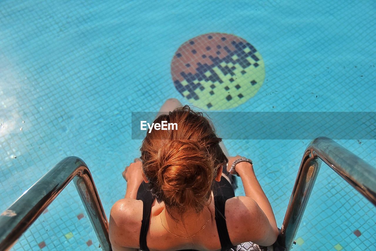 High angle view of woman in swimming pool