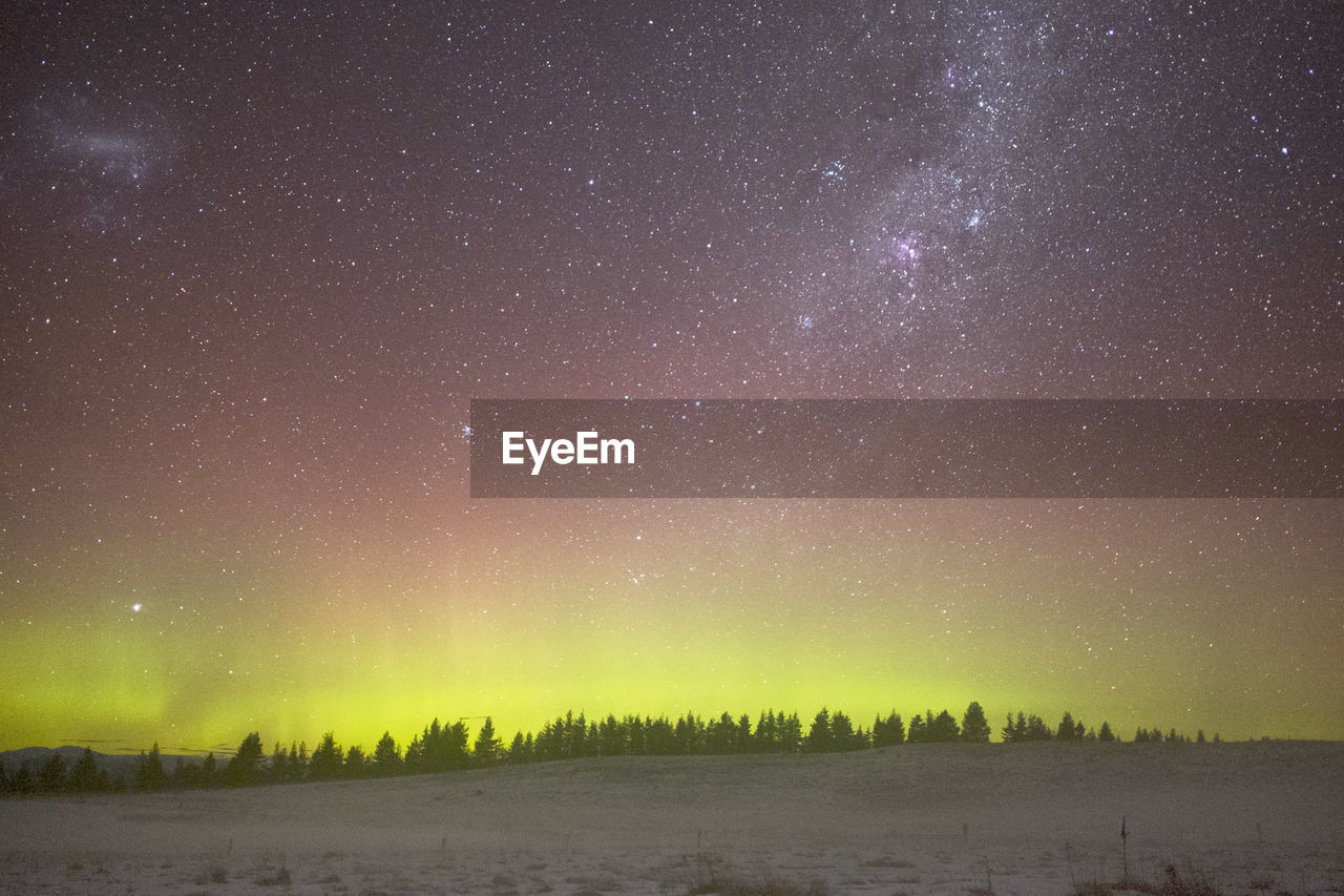 SCENIC VIEW OF LANDSCAPE AGAINST CLEAR SKY AT NIGHT