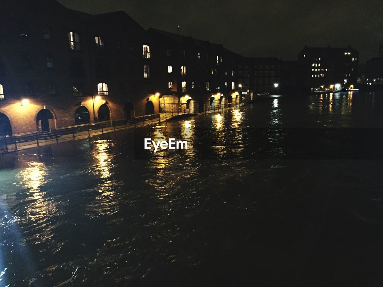 REFLECTION OF ILLUMINATED BUILDINGS IN WATER