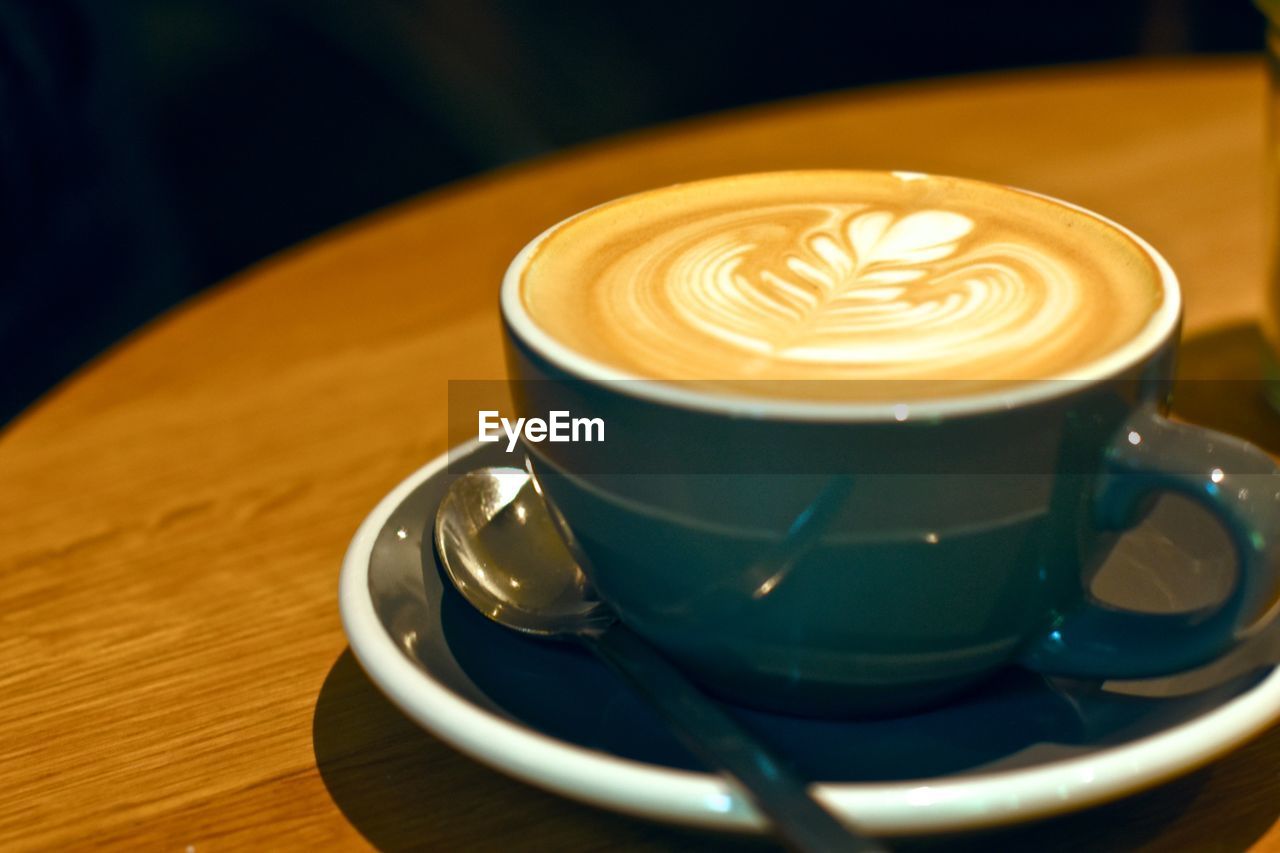 Close-up of coffee cup on table