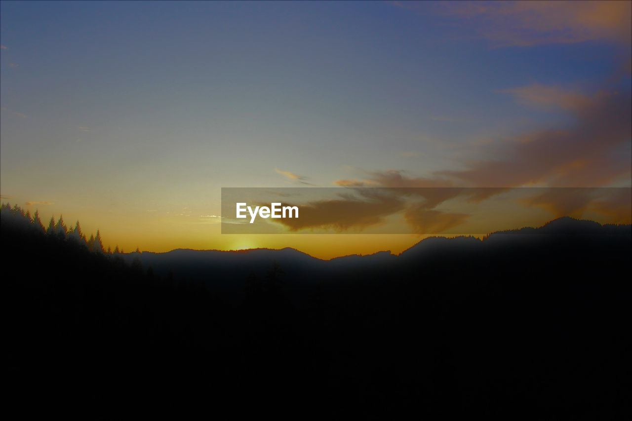 SILHOUETTE LANDSCAPE AGAINST SKY DURING SUNSET