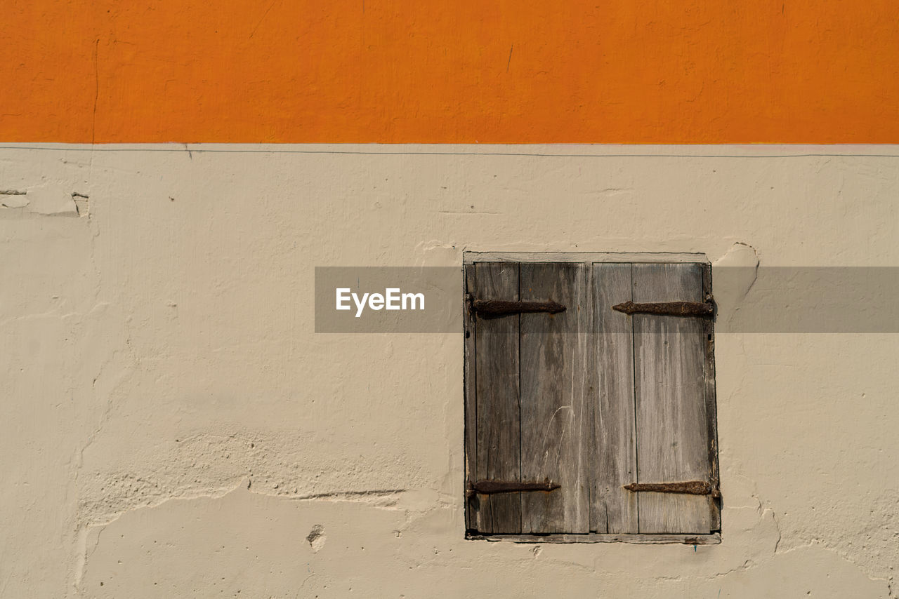 Closed window of old building