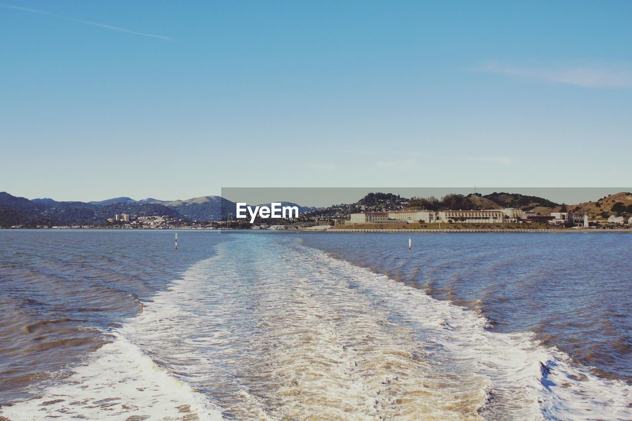Surface level of sea against blue sky