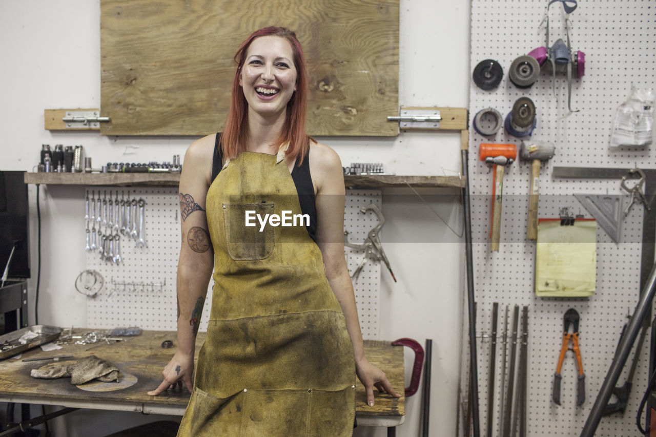 A portrait of a young woman in a dirty apron. 