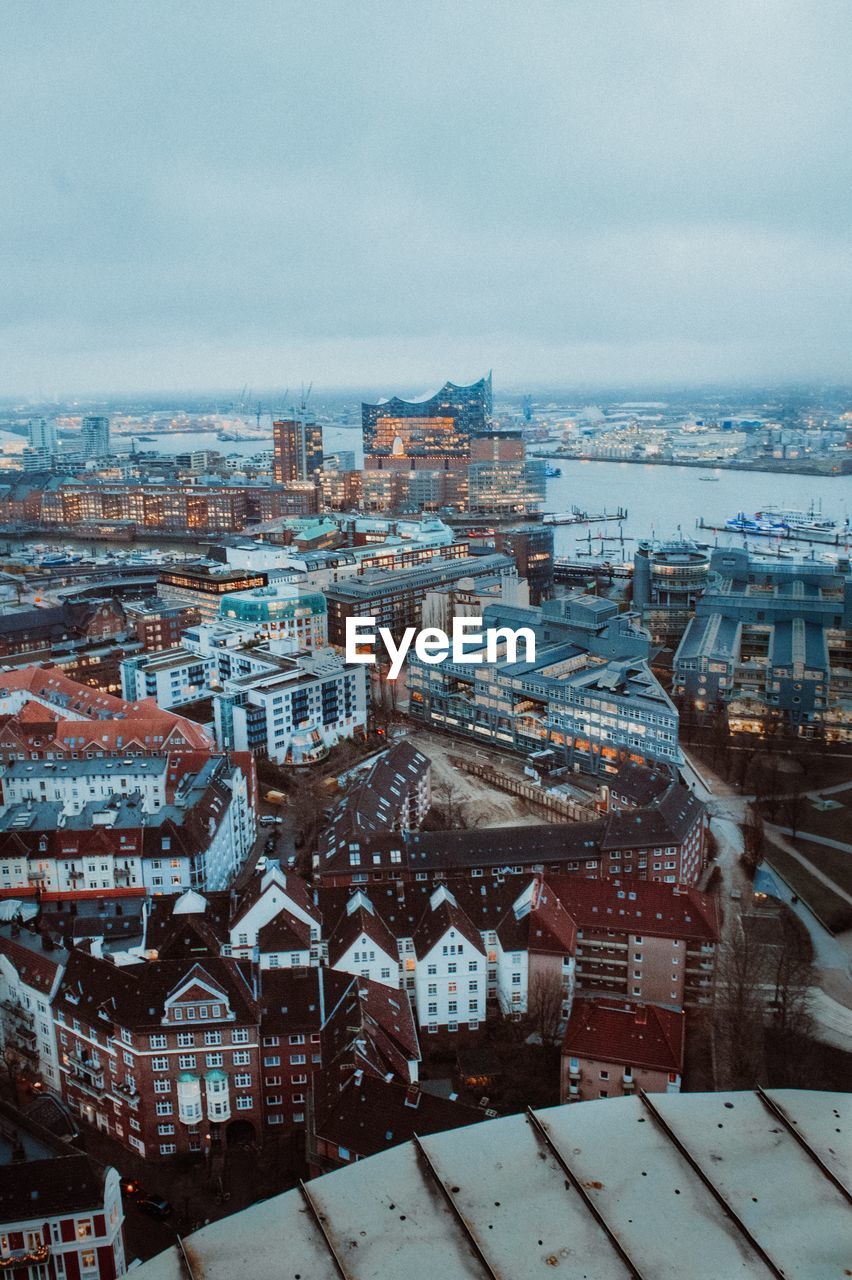 Aerial view of townscape against sky during winter