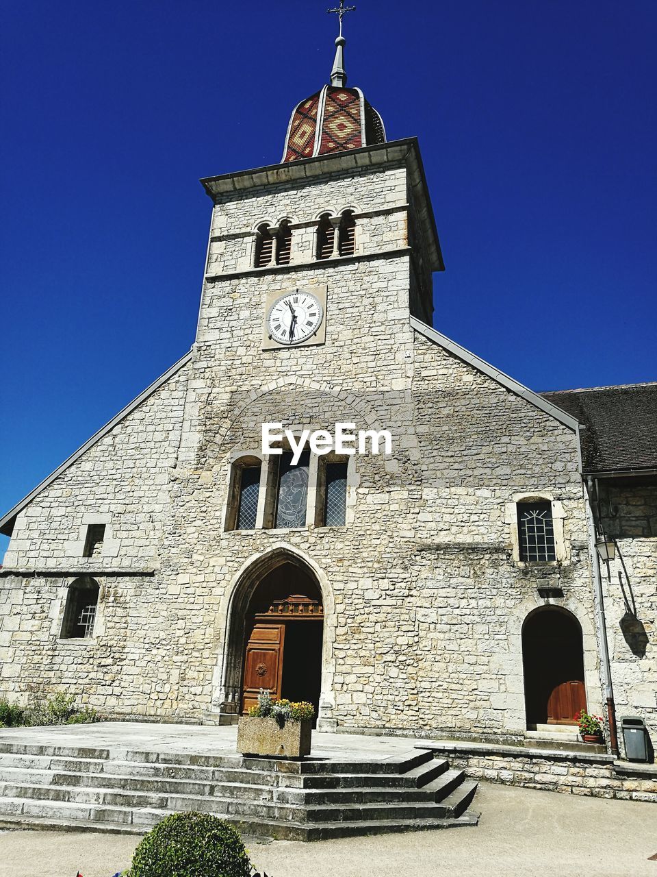 Low angle view of bell tower against clear sky