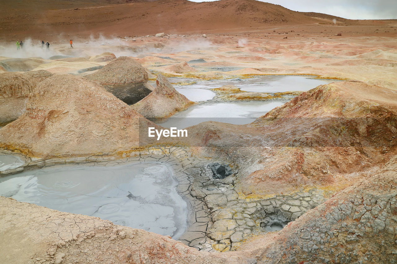 Boiling mud lakes in sol de manana or the morning sun geothermal field, potosi department of bolivia