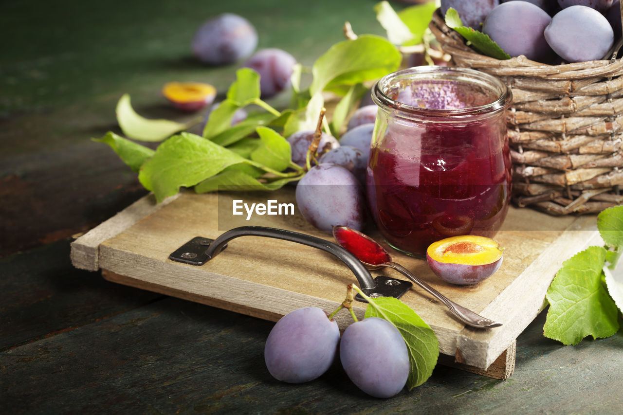 CLOSE-UP OF FRUITS ON TABLE AT HOME