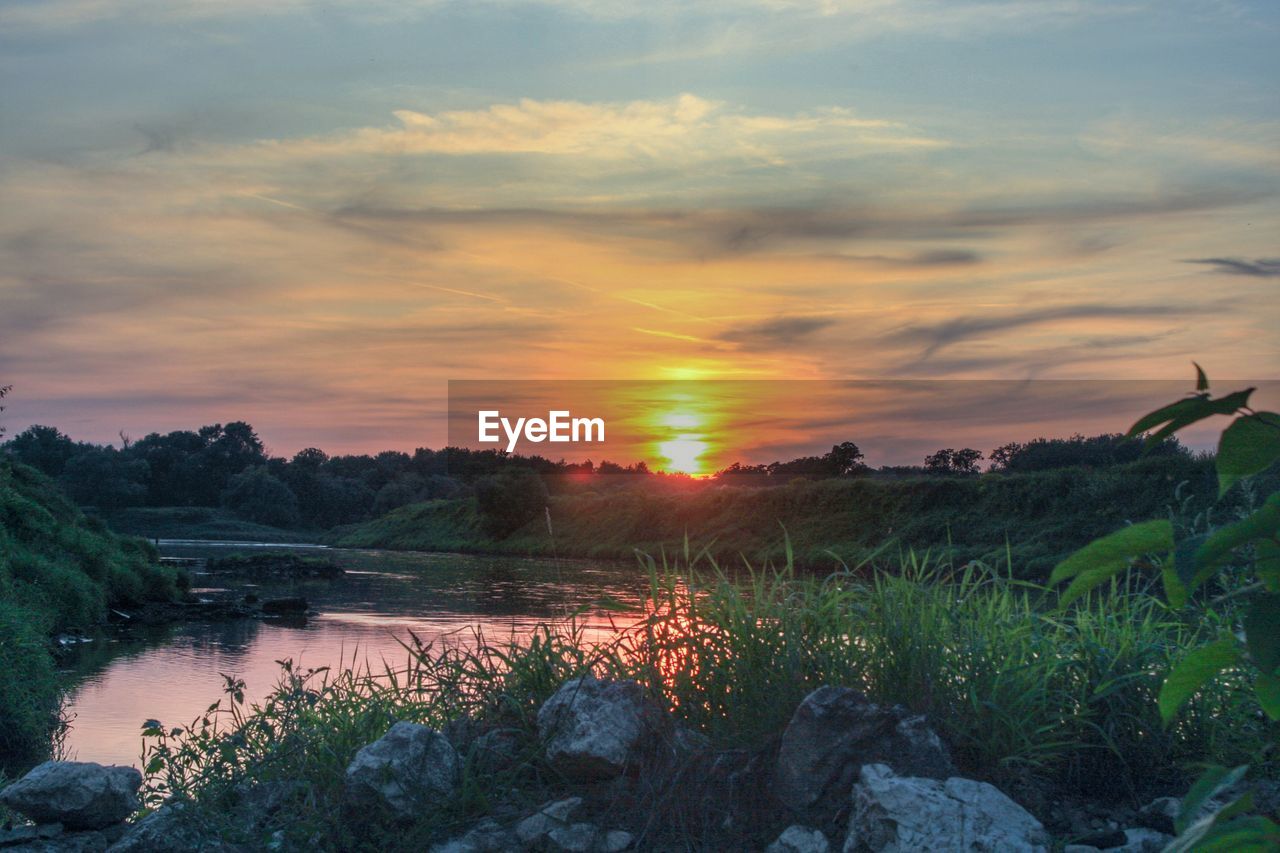 SCENIC VIEW OF LAKE DURING SUNSET