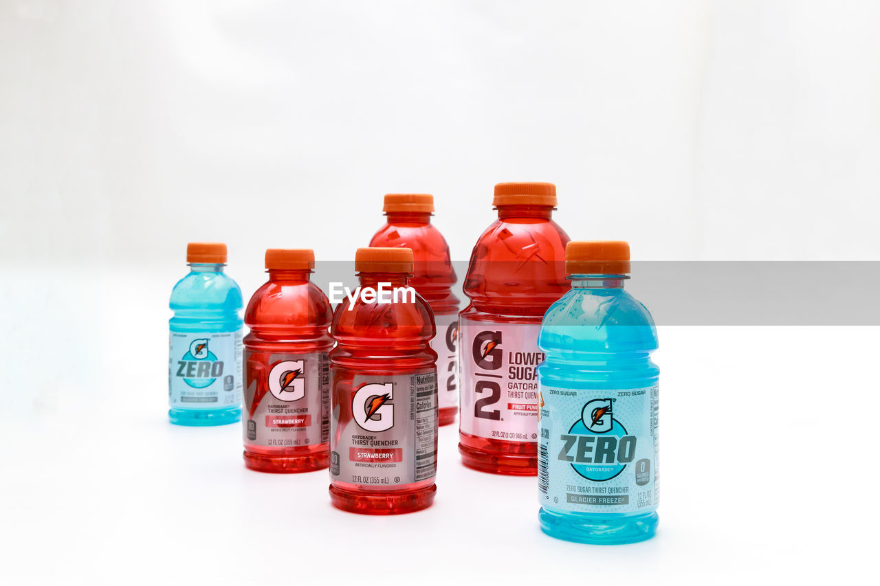 bottle, container, plastic bottle, white background, drinkware, healthcare and medicine, studio shot, medicine, indoors, no people, group of objects, variation, red, large group of objects, water, soft drink, cut out