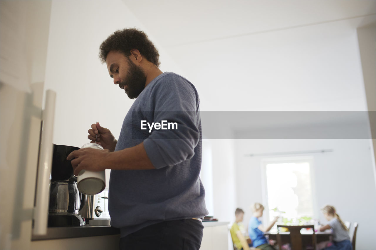 Man making coffee at home