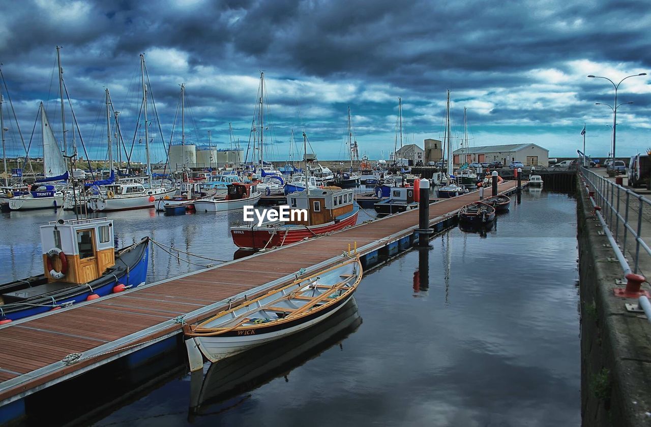 BOATS MOORED ON HARBOR