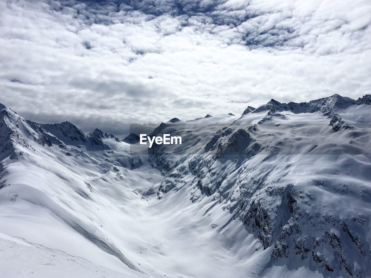 Scenic view of snow mountains against sky