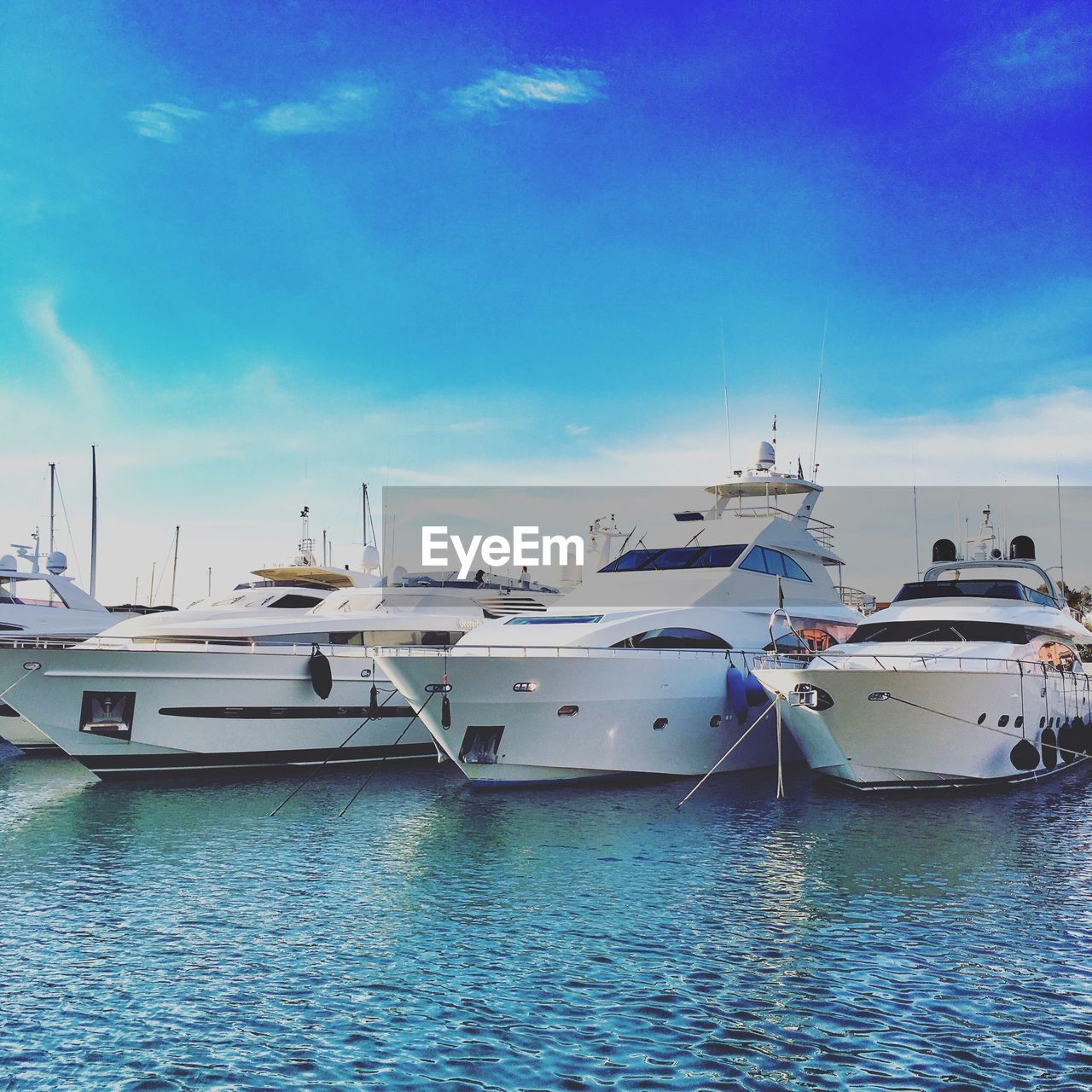 BOATS MOORED IN HARBOR