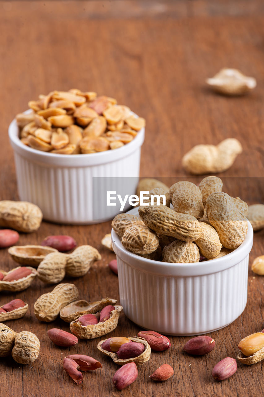 Dried peanuts on wood background