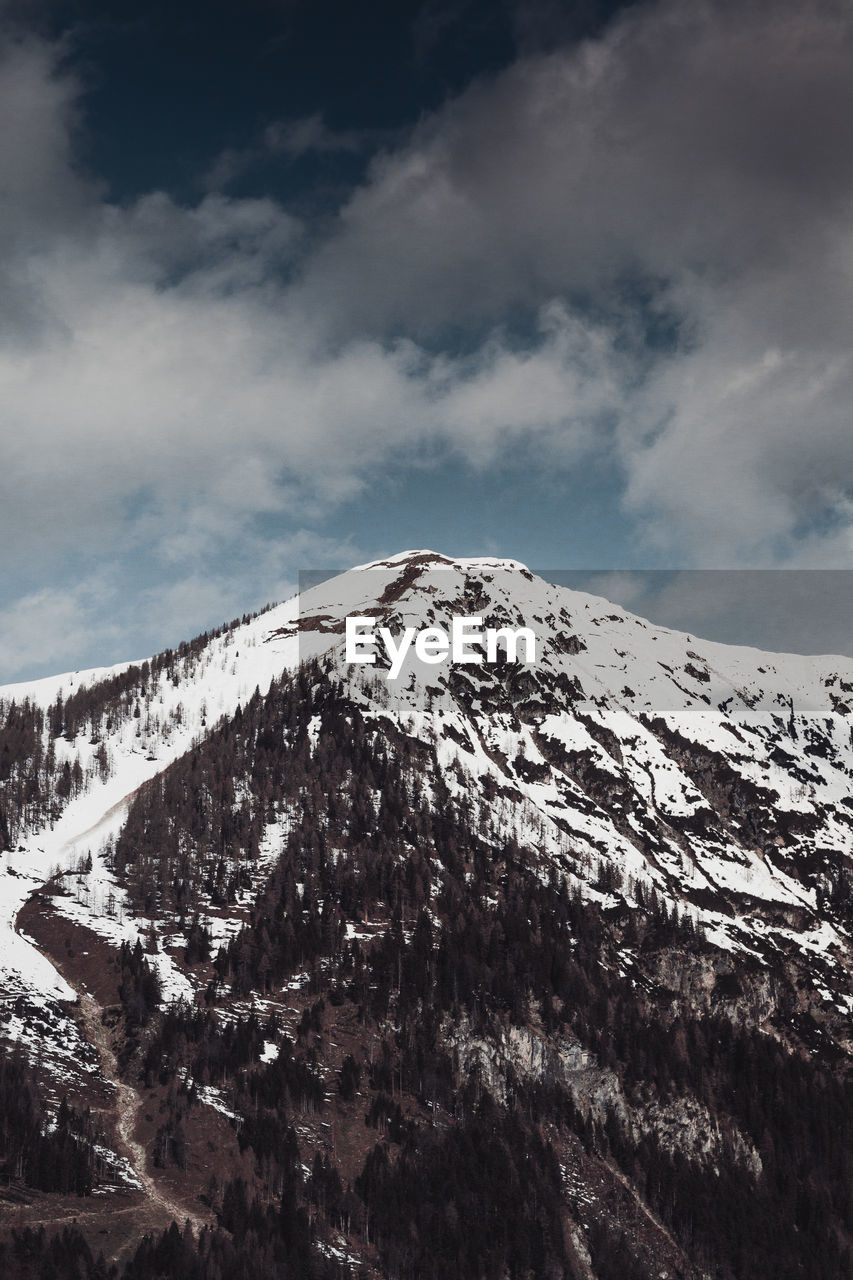 Scenic view of snow covered mountain against sky