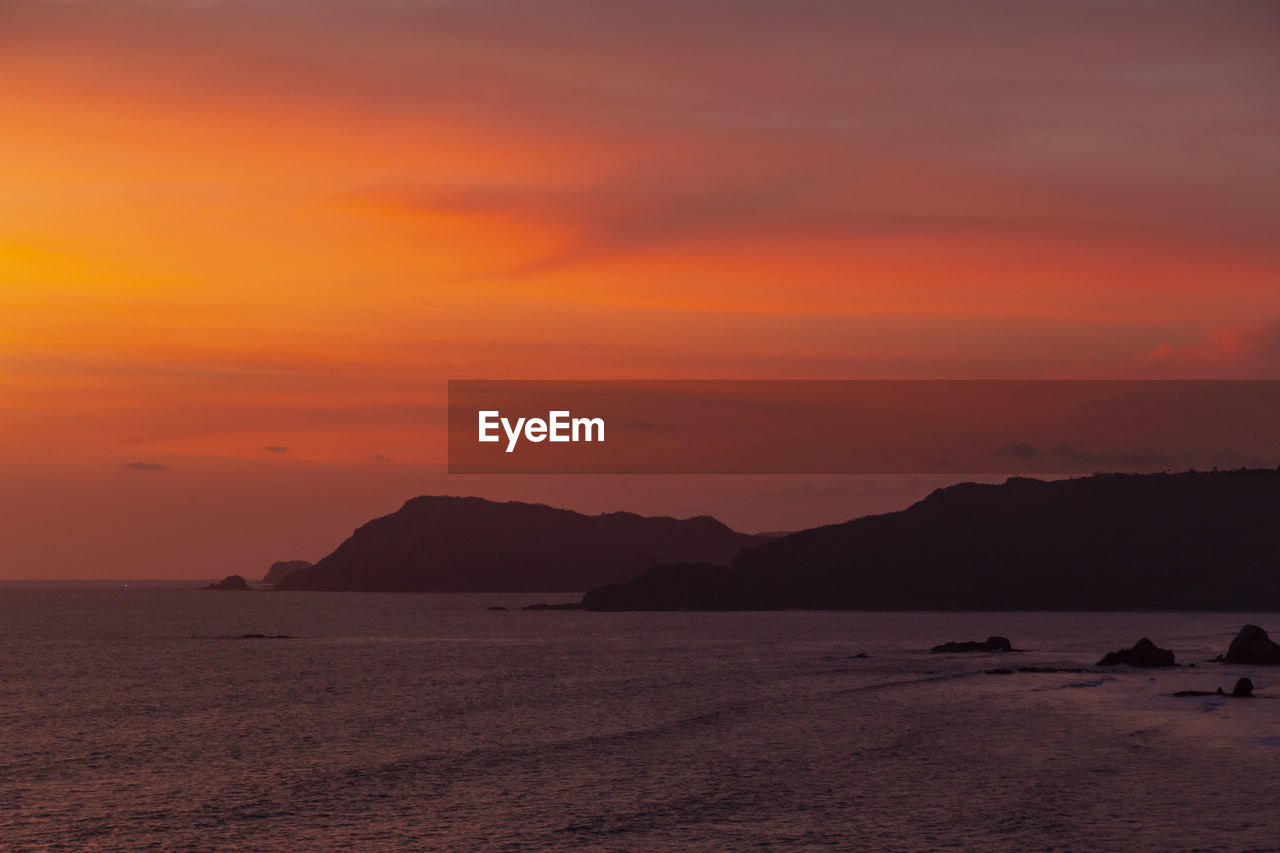 Sunset at indian ocean coastline