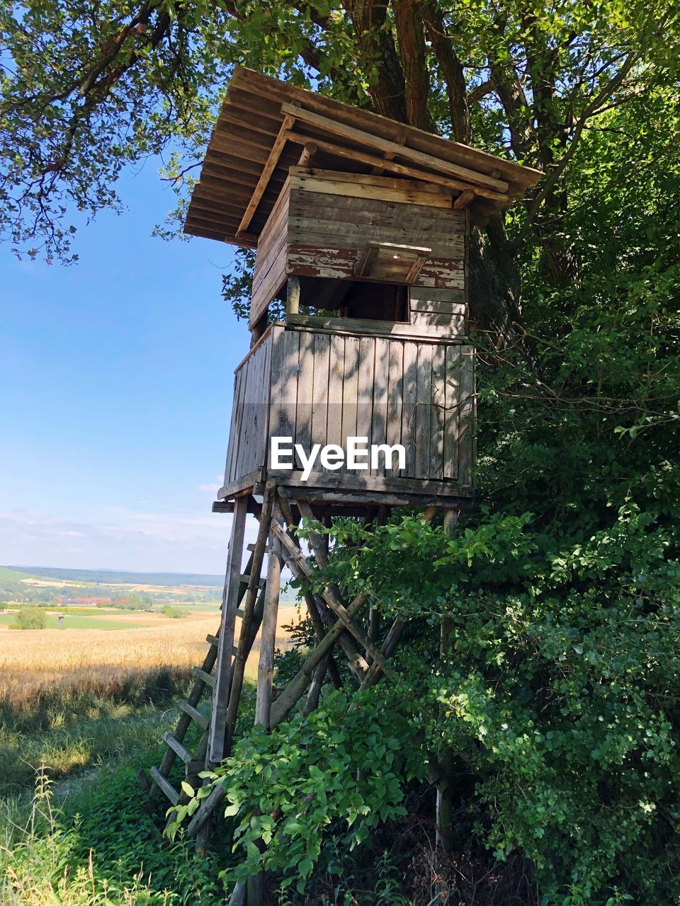 ABANDONED BUILT STRUCTURE ON FIELD