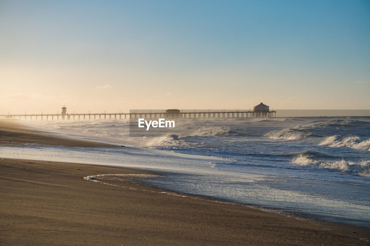 View of beach against sky during sunset