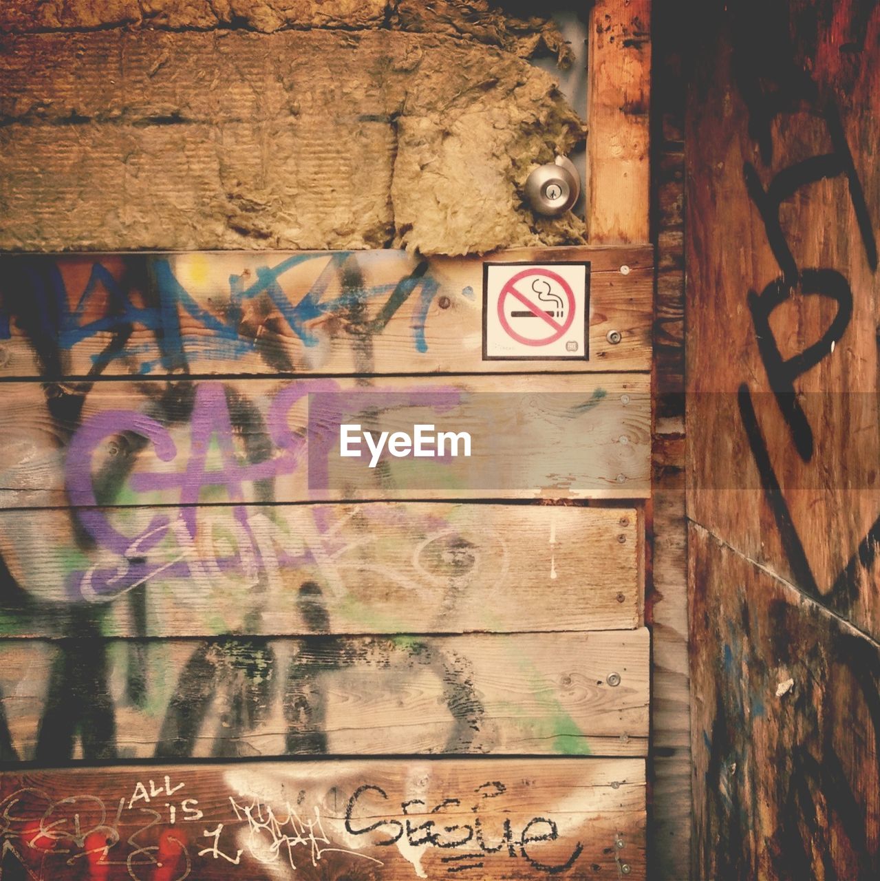 Graffiti on wooden door