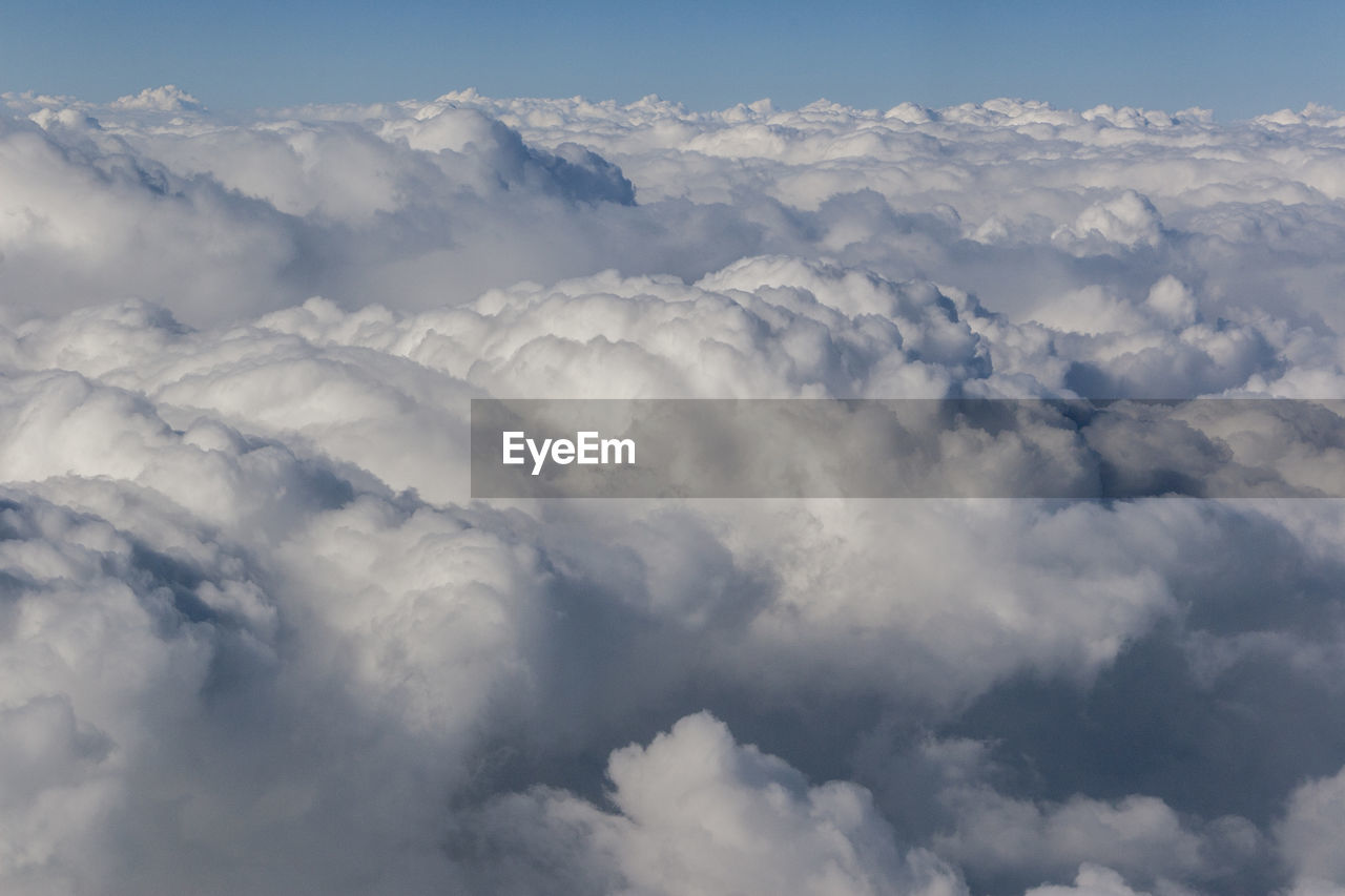 AERIAL VIEW OF CLOUDS OVER LANDSCAPE