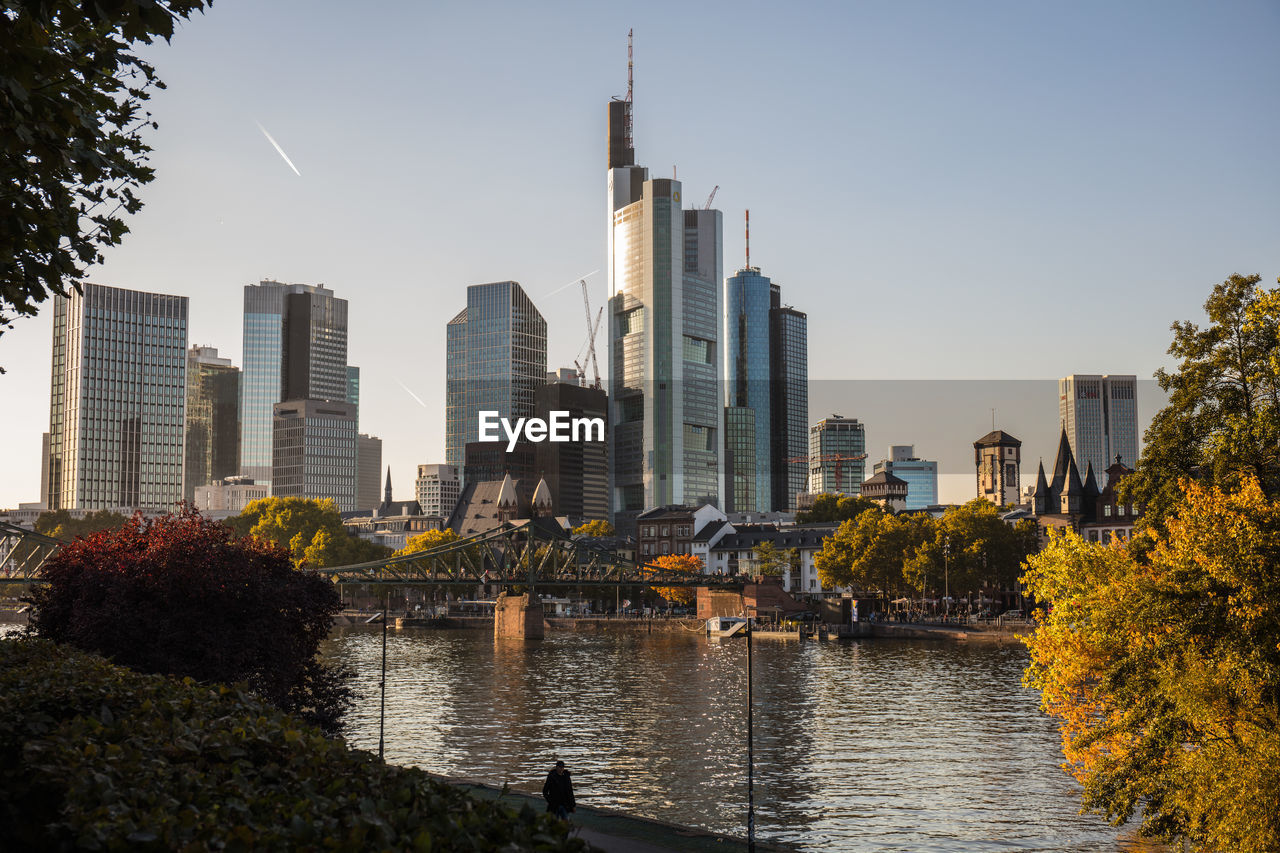 RIVER AND BUILDINGS AGAINST SKY