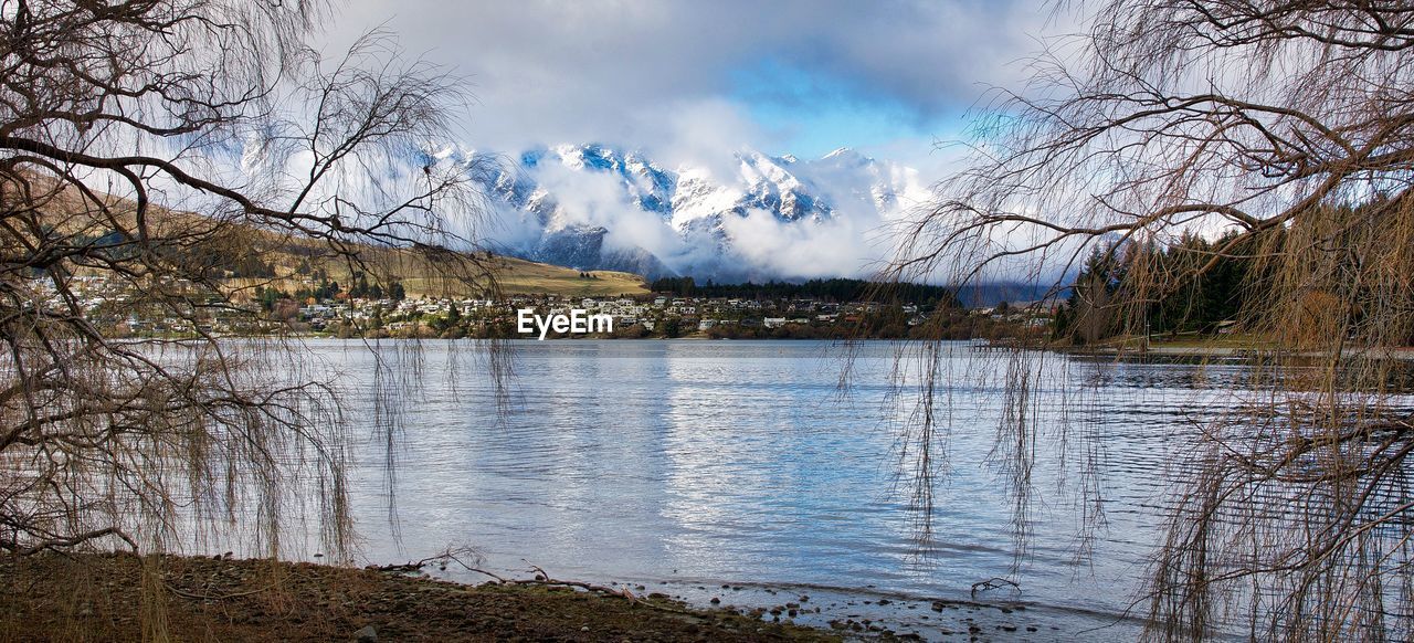 Scenic view of lake against sky during winter