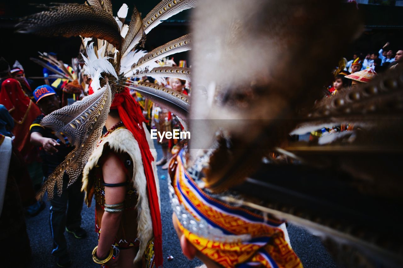 Close-up of men in traditional clothing at parade