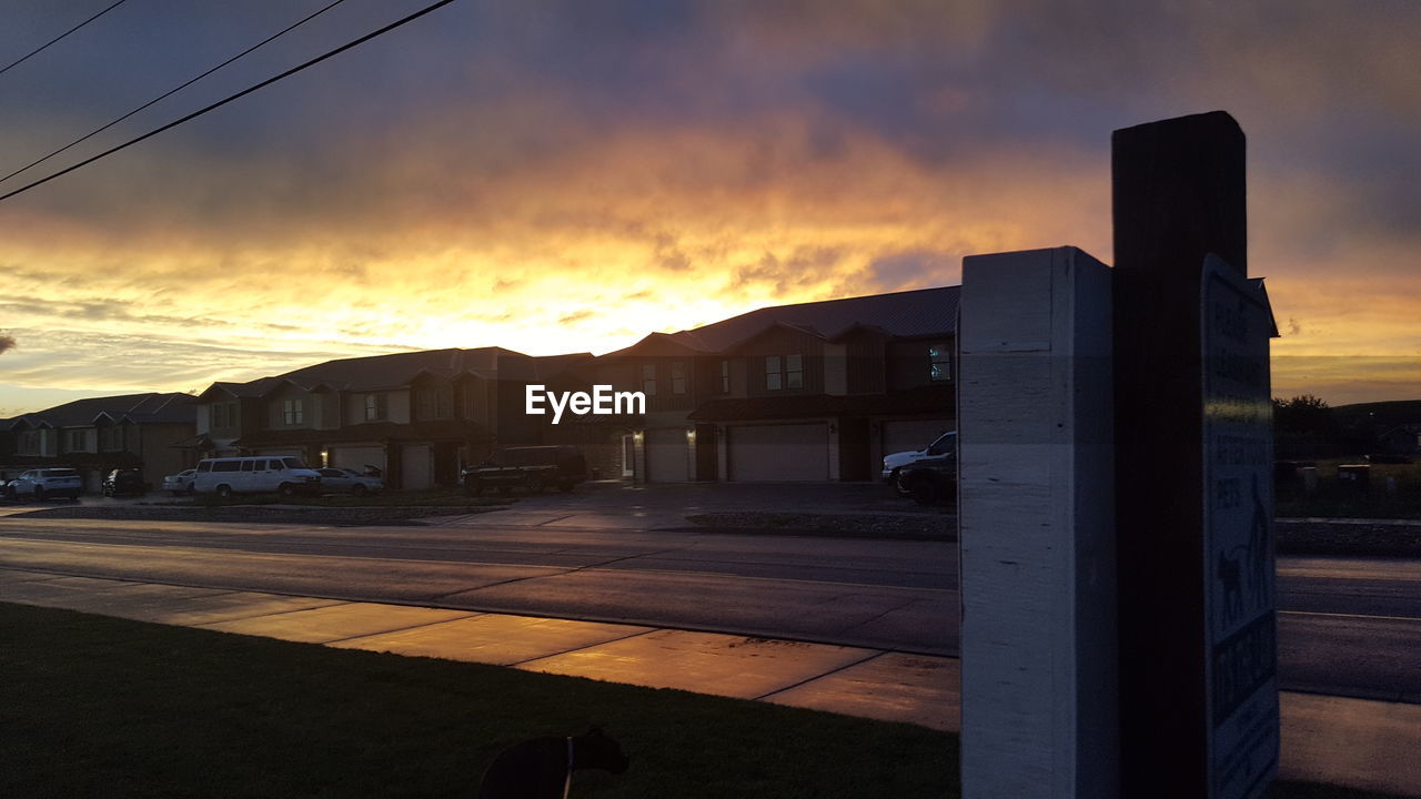 BUILDINGS AGAINST SKY AT SUNSET