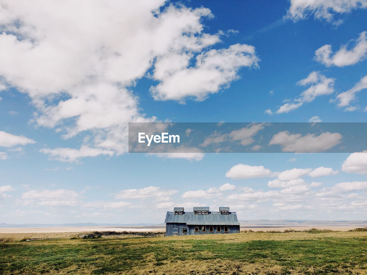 House on field against sky