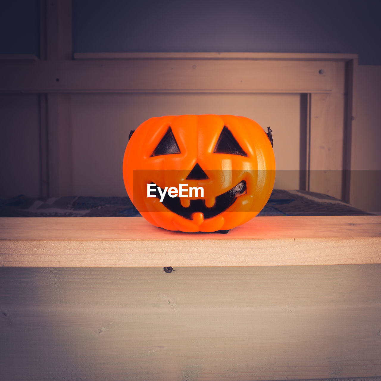 Spooky pumpkin lantern toy in a kids room