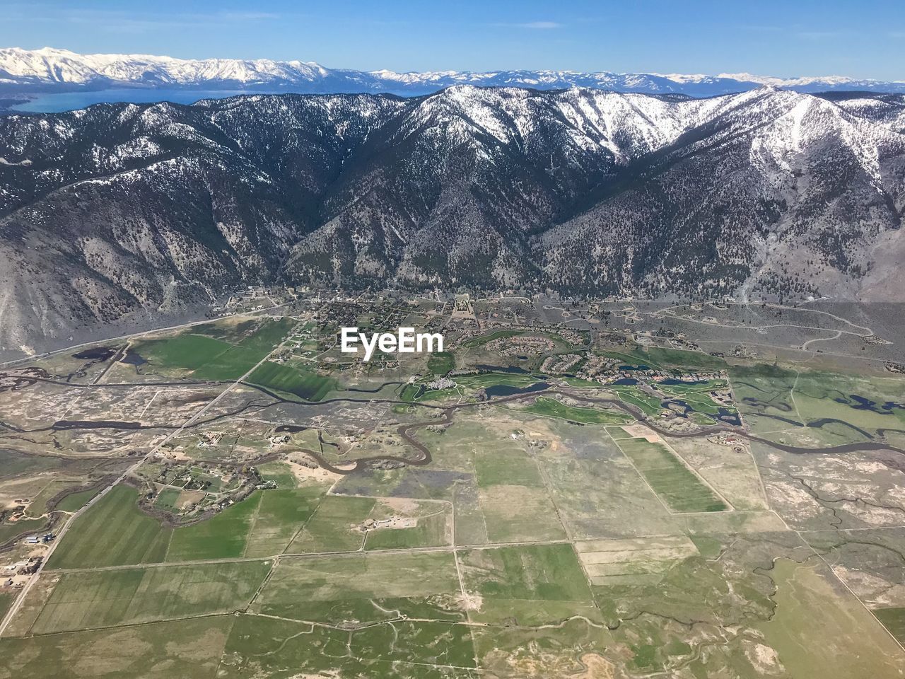 Aerial view of snowcapped mountains against sky