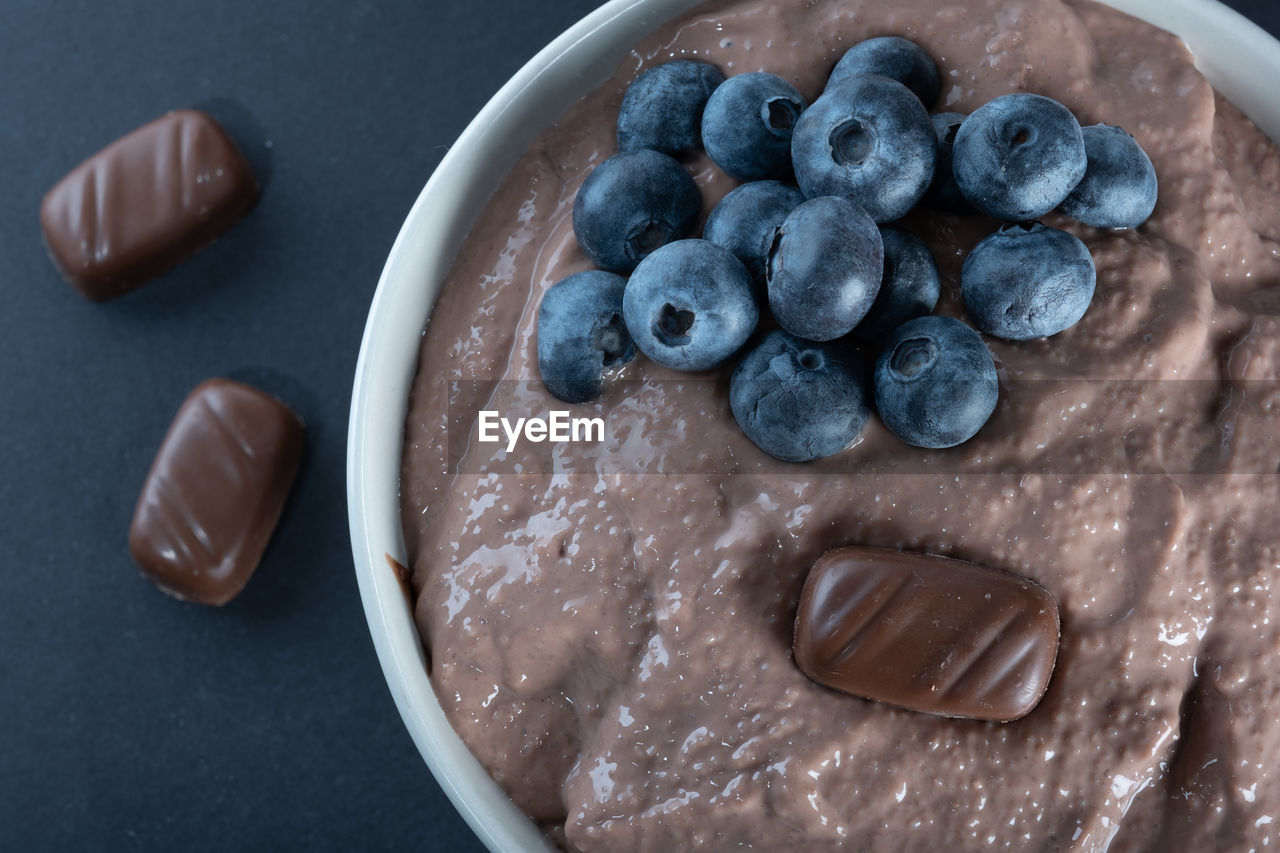 Traditional finnish foods - closeup of a bowl of chocolate porridge with blueberry topping