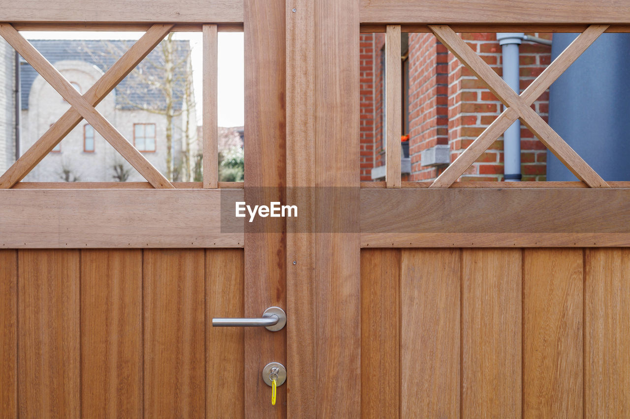 wood, architecture, entrance, door, no people, security, built structure, protection, house, hardwood, indoors, room, building, day, wood stain, furniture, window, construction industry, closed, residential district, brown, floor, home interior