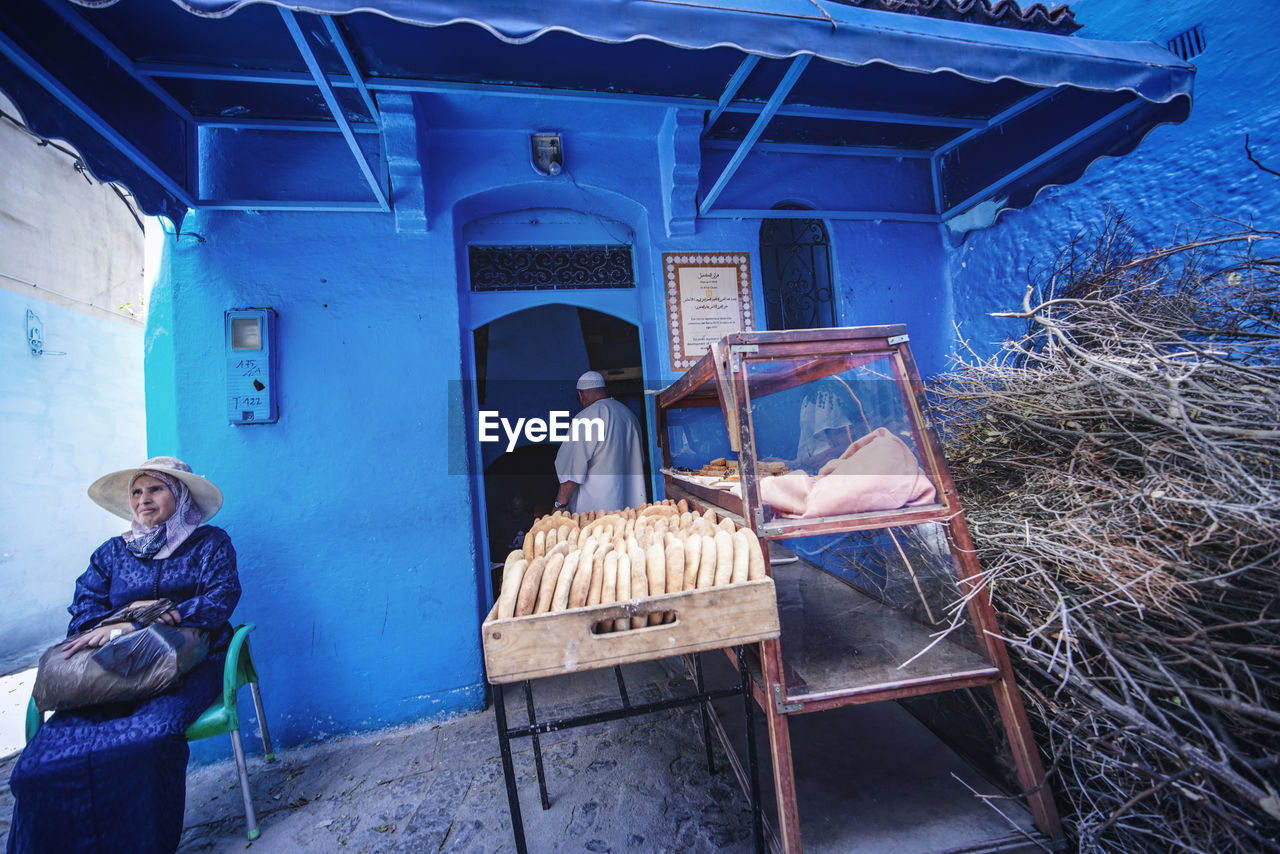 "The Blue City" - Chefchaouen, Morocco. Chefchaouen Chefchaouen Medina Medina Morocco MoroccoTrip EyeEmNewHere a new beginning Digital Nomad Travel Travel Destinations Traveling Travel Photography Photography Blue City Alley Maze Arabic Moroccans Tourism Tourist Attraction  Tourist Destination Real People Architecture Men People Day Two People Women Built Structure Adult Lifestyles Occupation Sitting Building Exterior Clothing Casual Clothing Standing Building Rear View