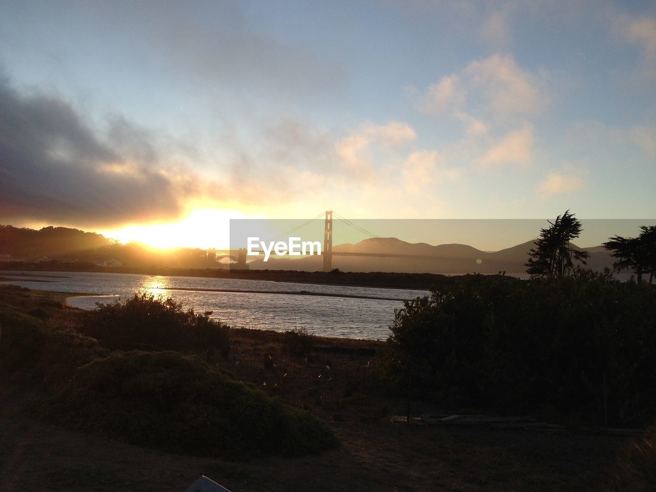 Sunset with clouds over coastline