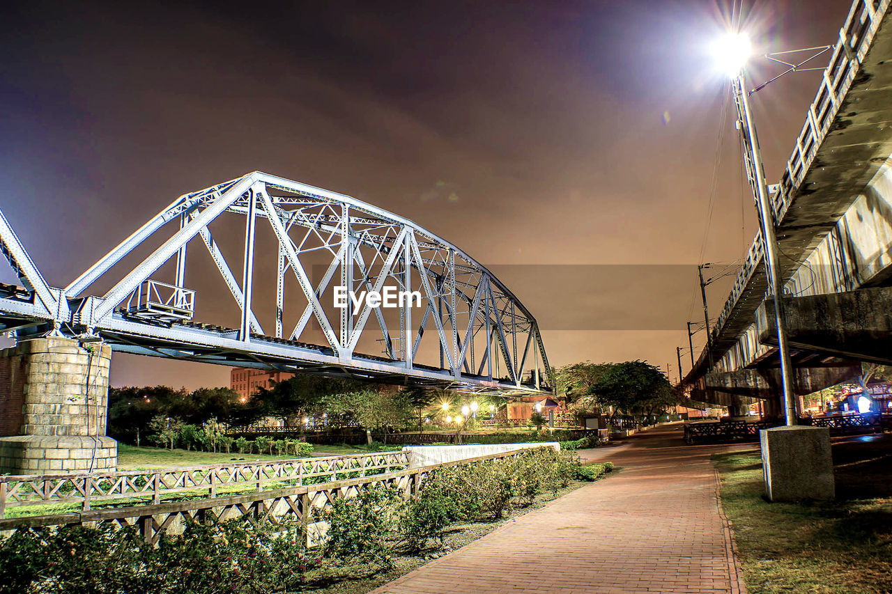 Low angle view of railway bridge at dust