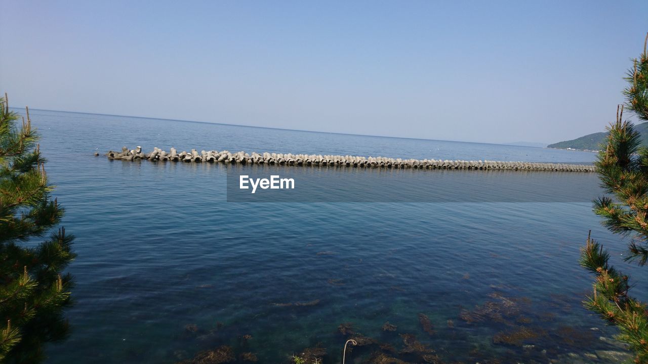 SCENIC VIEW OF BLUE SEA AGAINST CLEAR SKY