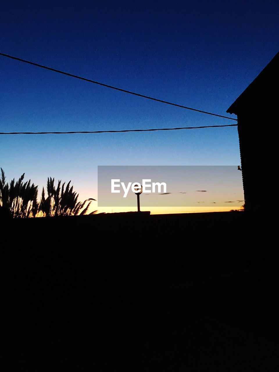 SILHOUETTE LANDSCAPE AGAINST CLEAR SKY