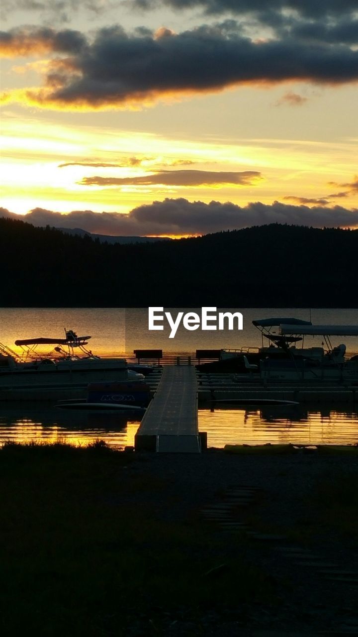 SCENIC VIEW OF SUNSET OVER LAKE