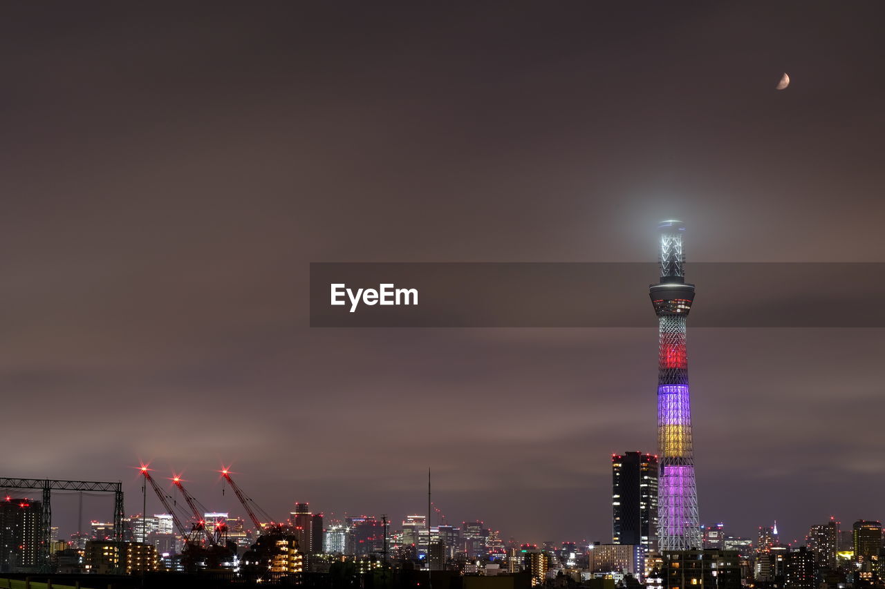 Illuminated buildings in city at night