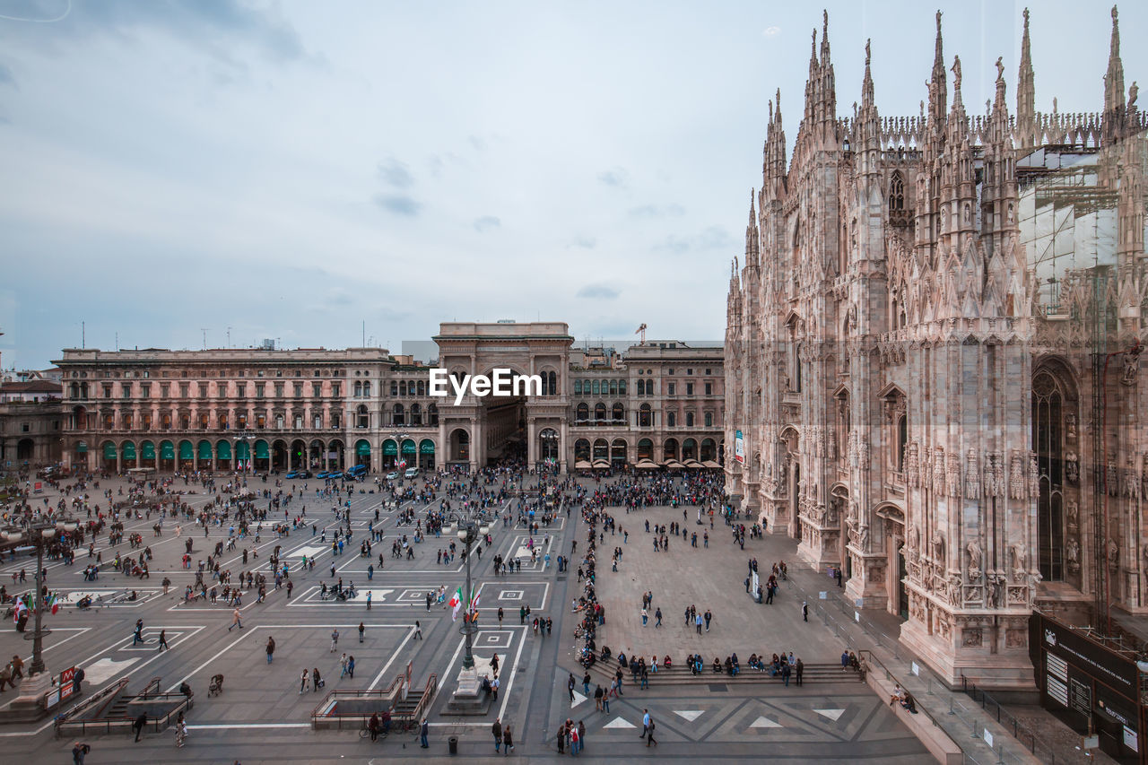 High angle view of people at piazza del duomo against sky