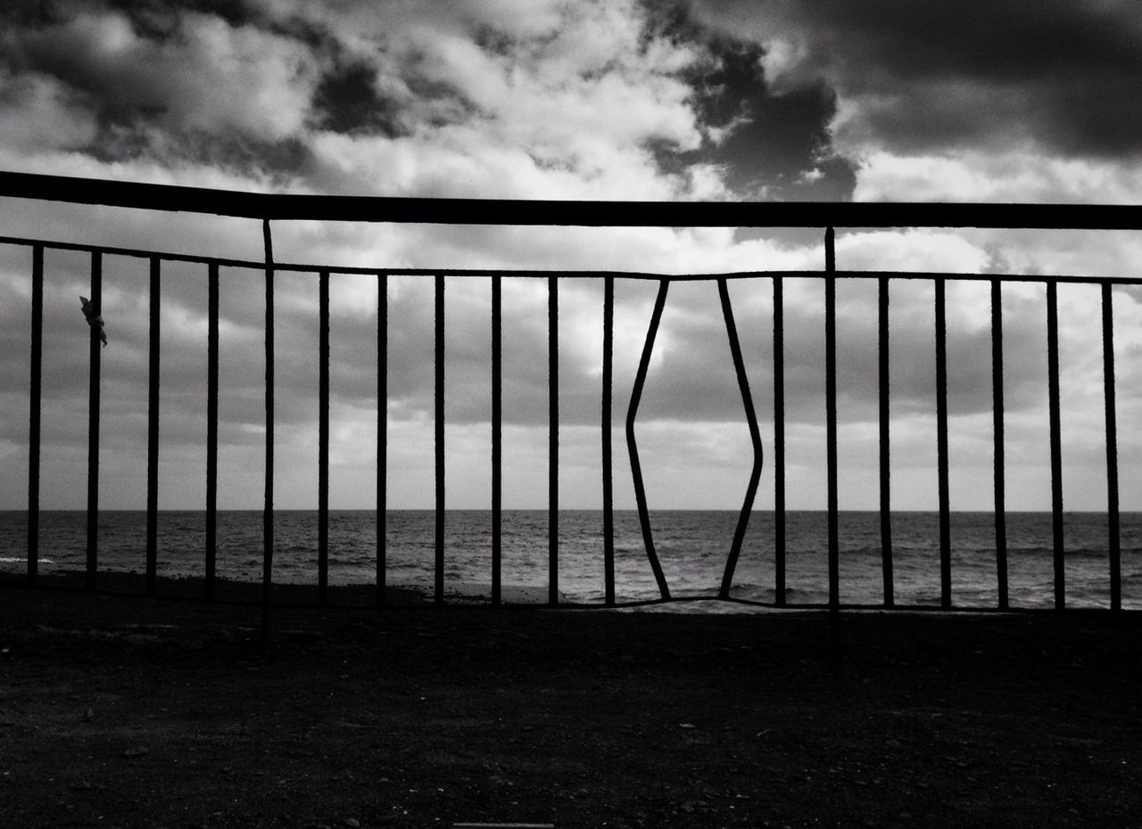 High angle view of calm sea against cloudy sky