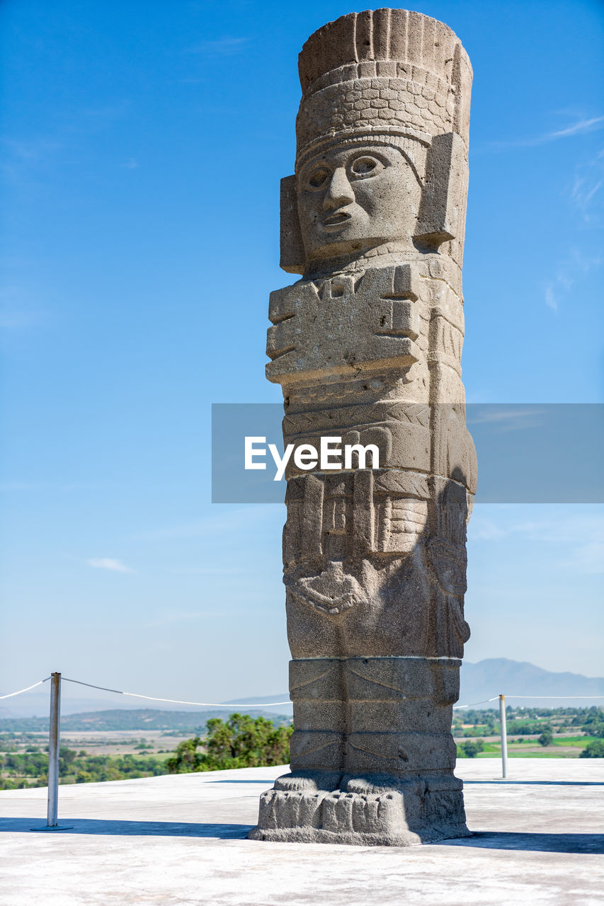 Low angle view of statue on floor against sky