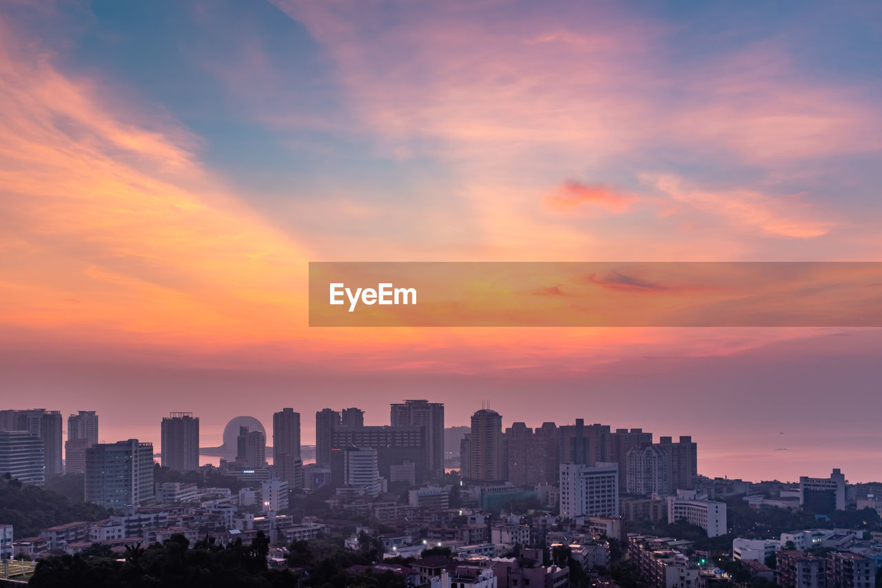 Cityscape against sky during sunset